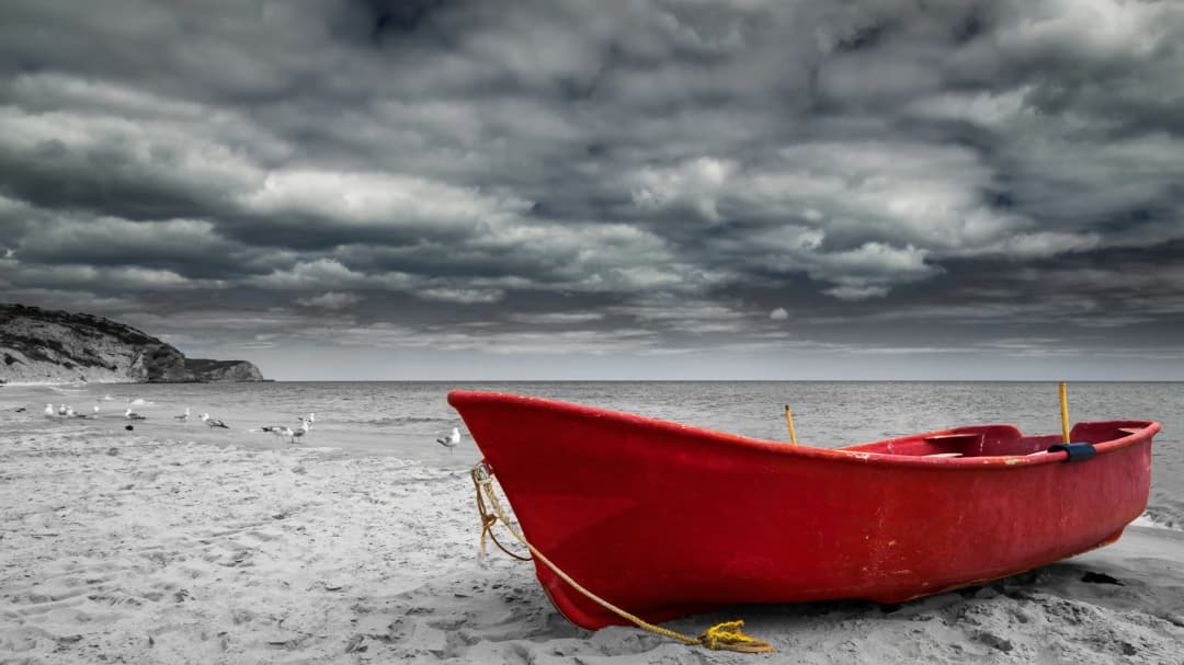 Red Boat Stormy Beach
